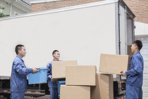 Professional man and van team coordinating a move in Bayswater